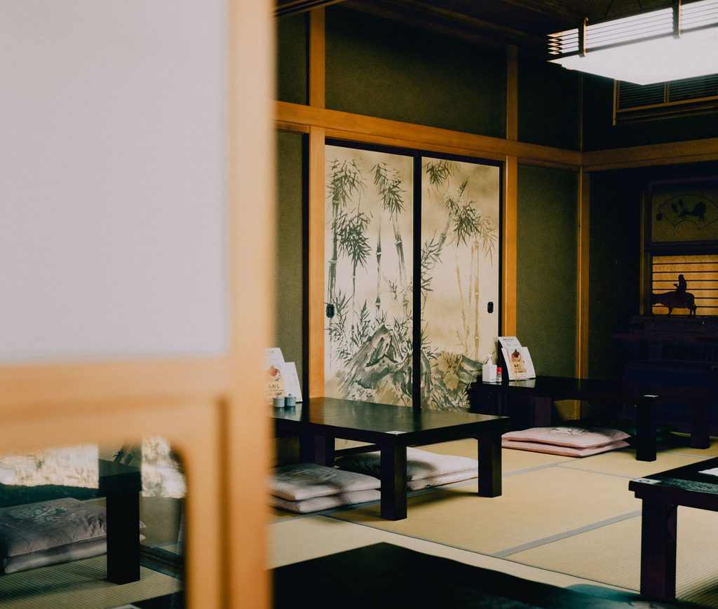 A tatami seating area at a casual set-meal restaurant. You take off your shoes and sit on floor cushions.